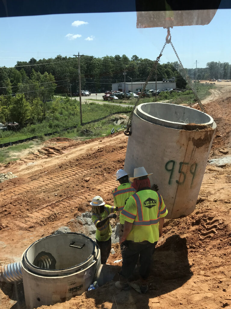 workers-connecting-drainage-pipe Workers connecting drainage.
